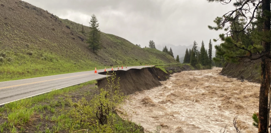 Flooding in Yellowstone causing damage to roadways.